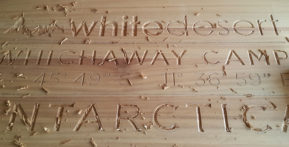 white desert wooden sign antarctica